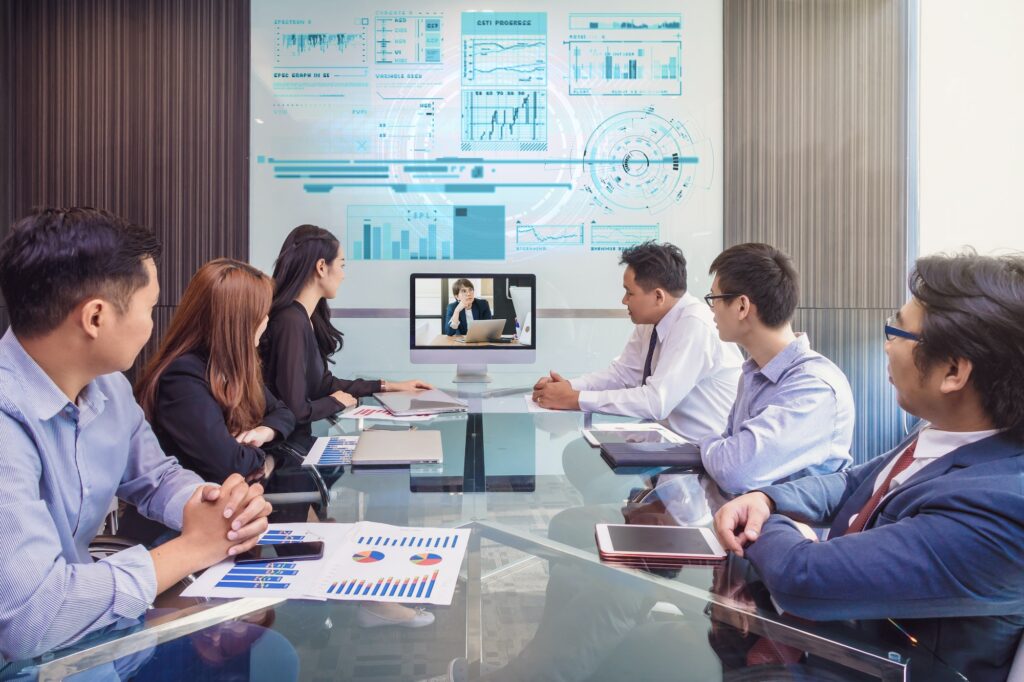 Group of asian Business team having video conference with their manager